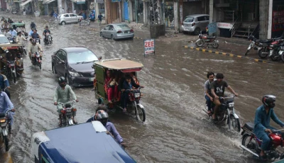 a view of vehicles passing through rain water photo inp