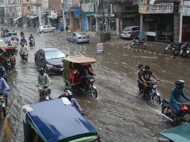 a view of vehicles passing through rain water photo inp a view of vehicles passing through rain water photo inp