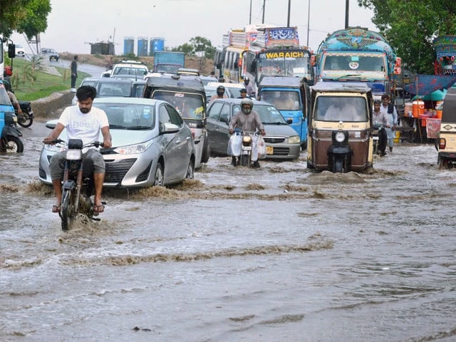 commuters wade through accumulated water after rainfall in the karachi on september 30 photo app commuters wade through accumulated water after rainfall in the karachi on september 30 photo app