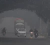 commuters ride along a street amid dense smog in lahore on november 1 2025 photo afp