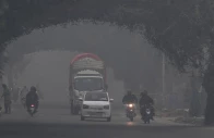 commuters ride along a street amid dense smog in lahore on november 1 2025 photo afp commuters ride along a street amid dense smog in lahore on november 1 2025 photo afp