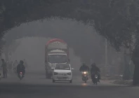 commuters ride along a street amid dense smog in lahore on november 1 2025 photo afp commuters ride along a street amid dense smog in lahore on november 1 2025 photo afp
