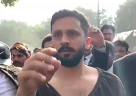 rajab butt being escorted out by his lawyers after the assault source the express tribune