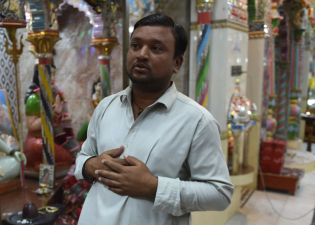 Rajesh Kumar, a mathematics graduate and teacher speaks during an interview. PHOTO: AFP