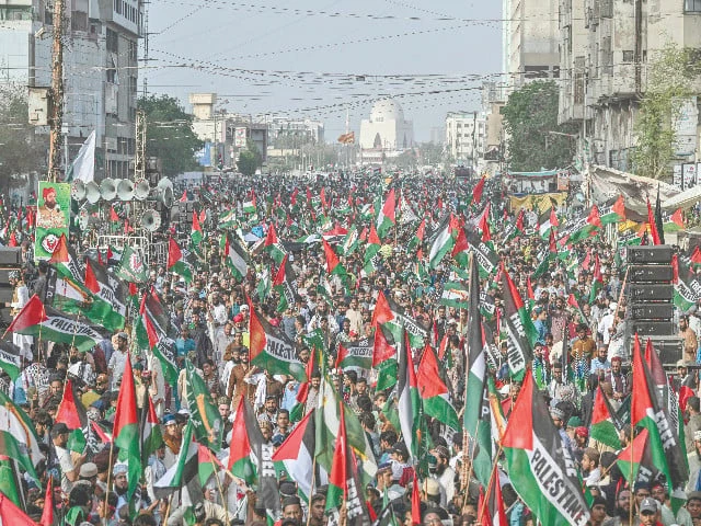 people holding palestinian flags march to show their solidarity with palestinians during an anti israel protest rally organised by tanzeemat ulema ahle sunnat wal jamaat photo afp people holding palestinian flags march to show their solidarity with palestinians during an anti israel protest rally organised by tanzeemat ulema ahle sunnat wal jamaat photo afp