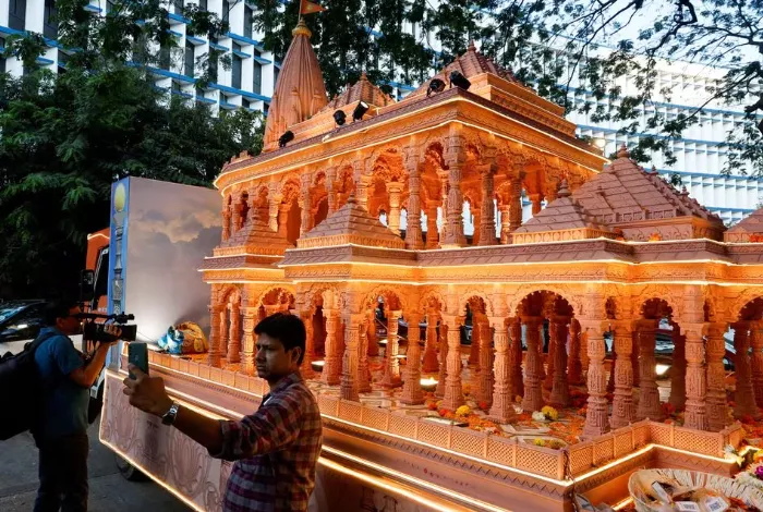 file photo a man takes a selfie with a replica of the ram mandir outside the bharatiya janata party s bjp headquarters in mumbai india january 16 2024 reuters file photo a man takes a selfie with a replica of the ram mandir outside the bharatiya janata party s bjp headquarters in mumbai india january 16 2024 reuters
