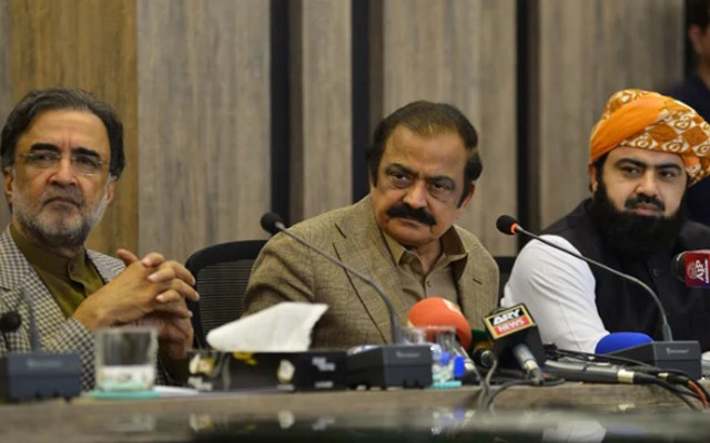 interior minister rana sanaullah c along with ruling collation parties leaders qamar zaman kaira l and asad mehmood r listen to a question during a press conference in islamabad on may 24 2022 photo afp