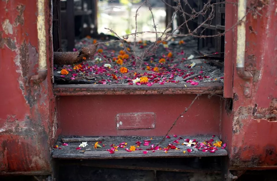 flower petals scattered by the relatives of godhra riots victims are pictured at the doorsteps of a train carriage that was set on fire in 2002 during the commemoration of the 12th anniversary of godhra riots at godhra in the western indian state of gujarat february 27 2014 photo reuters file flower petals scattered by the relatives of godhra riots victims are pictured at the doorsteps of a train carriage that was set on fire in 2002 during the commemoration of the 12th anniversary of godhra riots at godhra in the western indian state of gujarat february 27 2014 photo reuters file