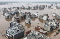 this aerial view shows partially submerged residential buildings following the overflowing of the ravi river in lahore on august 30 2025 photo afp
