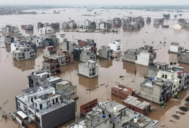 this aerial view shows partially submerged residential buildings following the overflowing of the ravi river in lahore on august 30 2025 photo afp