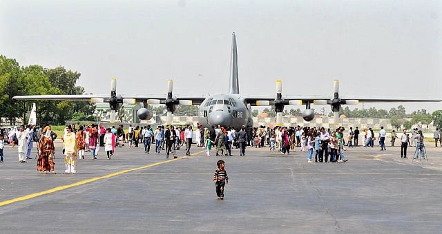 a number of people keenly watching aircraft and weapons displayed at nur khan air base photo app a number of people keenly watching aircraft and weapons displayed at nur khan air base photo app