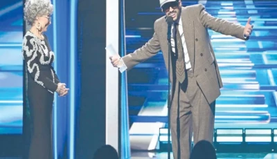 bad bunny speaks as puerto rican actor rita moreno looks on during the billboard latin music awards ceremony in miami photo billboard