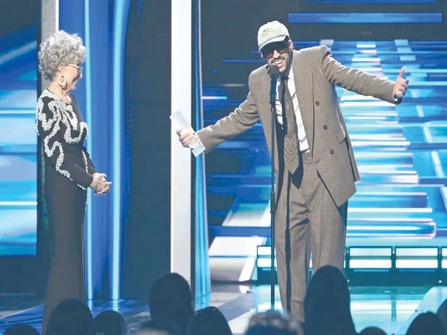 bad bunny speaks as puerto rican actor rita moreno looks on during the billboard latin music awards ceremony in miami photo billboard bad bunny speaks as puerto rican actor rita moreno looks on during the billboard latin music awards ceremony in miami photo billboard