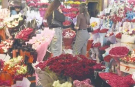 customers throng a flower stall selecting bouquets heart shaped arrangements and gift hampers on valentine s day in the federal capital photo online