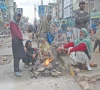 labourers in rawalpindi gather around a fire to keep warm during rainy weather while waiting for customers to hire them for daily wage work to support their families photo online labourers in rawalpindi gather around a fire to keep warm during rainy weather while waiting for customers to hire them for daily wage work to support their families photo online