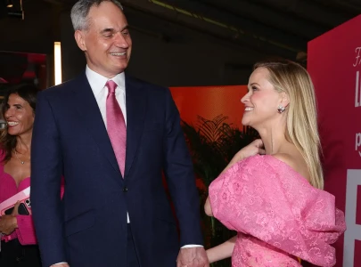 reese witherspoon and oliver haarmann make rare public appearance at elle premiere