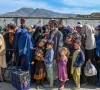 afghan refugees wait in a queue to cross the pakistan afghanistan border in torkham on october 27 2023 photo afp
