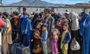 afghan refugees wait in a queue to cross the pakistan afghanistan border in torkham on october 27 2023 photo afp