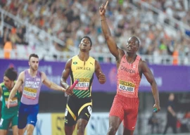canada s eliezer adjibi reacts as he crosses the finish line in the mixed 4x100m relay final of the world athletics relays in guangzhou china s guangdong province on may 11 photo afp