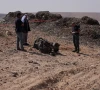 a police officer and residents inspect the remains of a rocket booster near arad israel april 14 2024 photo reuters