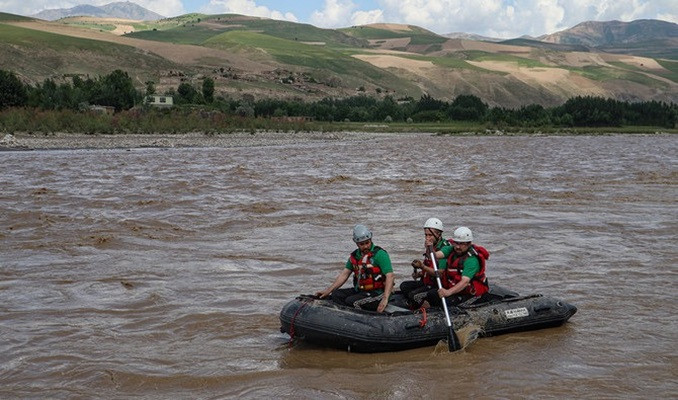 members of a rescue team search for missing persons in the kokcha on the outskirts fayzabad in badakhshan province on may 26 2024 photo afp