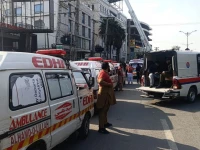 ambulances and rescue personnel at the site photo reporter