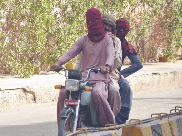 a trio travels on a motorcycle with their heads covered in hyderabad where the mercury rose to 39 c on friday photo ppi a trio travels on a motorcycle with their heads covered in hyderabad where the mercury rose to 39 c on friday photo ppi