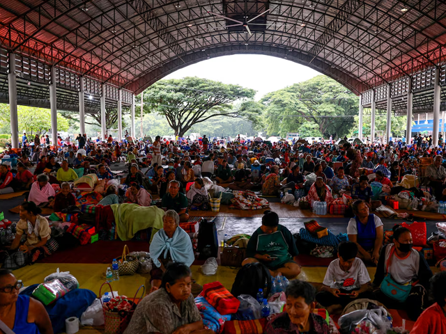 People rest inside a temporary shelter in Srisaket province, after Thailand and Cambodia exchanged heavy artillery fire. Photo: Reuters