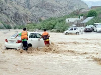 flash floods rescue workers assist stranded motorists after heavy monsoon rains inundate roads in landi kotal khyber district photo ppi