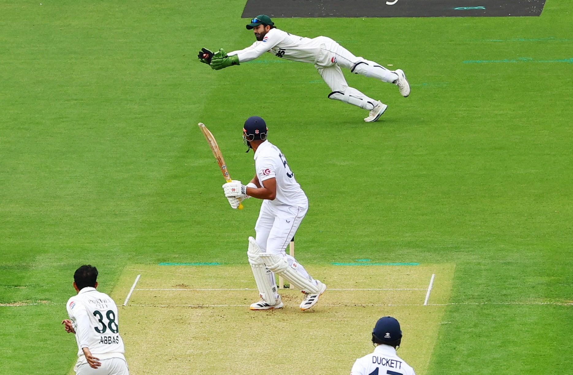 Pakistan's Muhammad Rizwan catches the ball to take the wicket of  England's Emilio Gay. Photo: Reuters
