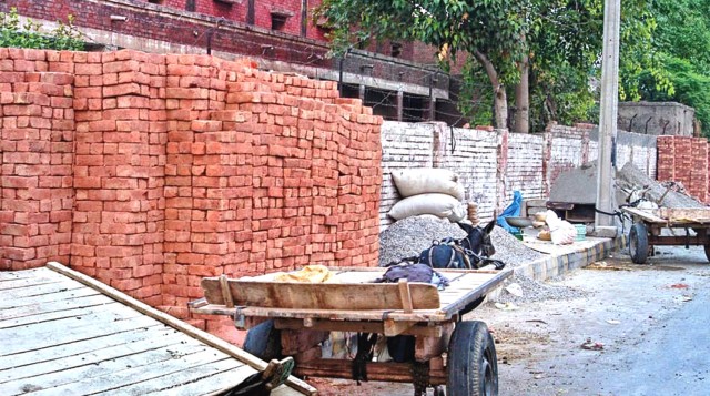 gulberg footpaths losing out to encroachers