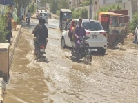 city s sewerage system remains stalled leaving roads waterlogged traffic paralysed and residents facing rising health risks photo express