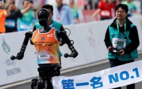 robots join thousands in beijing half marathon to showcase china s tech robots join thousands in beijing half marathon to showcase china s tech