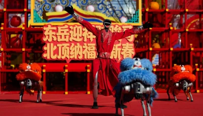 a humanoid robot performs a dance with robot dogs dressed in lion costumes on the first day of the lunar new year of the horse at the niangniang temple in beijing china february 17 2026 photo reuters