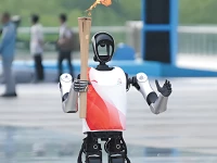 robot holding torch for china s 15th national games in shenzhen photo china daily x