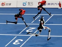 a tiangong ultra humanoid robot crosses the finish line in 8 86 seconds next to honor humanoid robots during a 100m large size group semifinal race at the 2026 world humanoid robot games at the national speed skating oval in beijing china august 25 2026 reuters