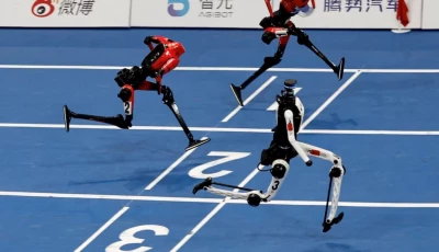 a tiangong ultra humanoid robot crosses the finish line in 8 86 seconds next to honor humanoid robots during a 100m large size group semifinal race at the 2026 world humanoid robot games at the national speed skating oval in beijing china august 25 2026 reuters