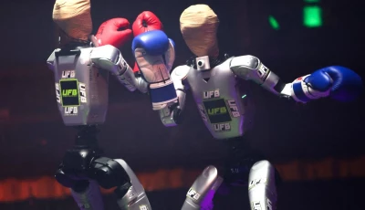 robots wear boxing gloves as they exchange punches during the ultimate fighting bots ufb competition at the battlebots arena on the sidelines of the annual consumer electronics show ces in las vegas nevada on january 6 2026 afp