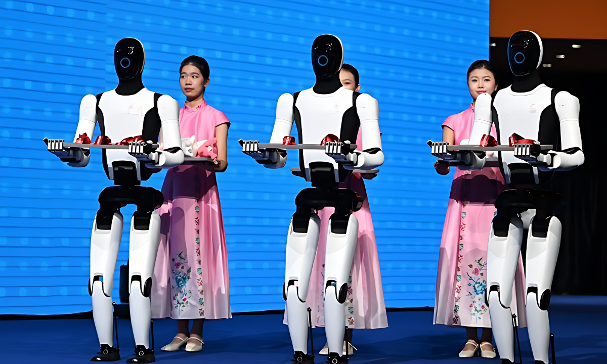 Humanoid robots hold medals during the award ceremony for the men's 92kg of boxing at China's 15th National Games in Shenzhen, south China's Guangdong Province, on Nov. 14, 2025. PHOTO: GLOBAL TIMES