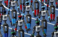 booster robotics humanoid robots walk in formation during the opening ceremony for the second world humanoid robot games at the national speed skating oval in beijing china august 22 2026 photo reuters