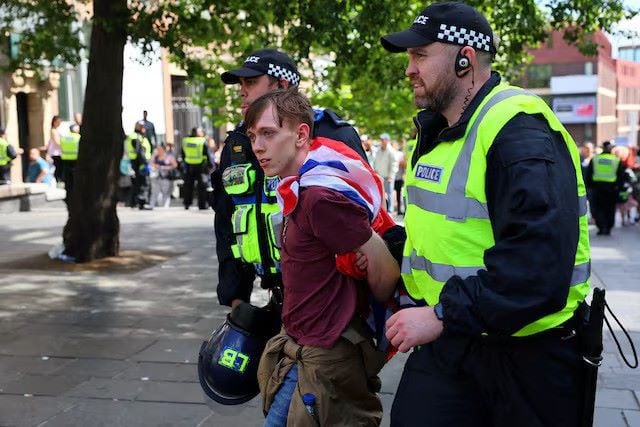 an anti immigration protester is detained by police officers in newcastle britain august 10 2024 photo reuters