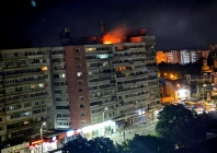 a fire burns on the roof of a 10 story block of flats after a drone crashed into the building causing an explosion and injuring two people near the border with ukraine in galati romania in this handout image released on may 29 2026 photo romanian department for emergency situations via reuters