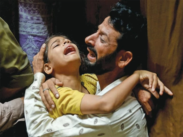 grieved a father and daughter mourn the loss of family members who were killed when the roof of their home collapsed in lahore photo reuters grieved a father and daughter mourn the loss of family members who were killed when the roof of their home collapsed in lahore photo reuters