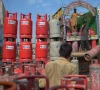 laborers unload gas calendar from a truck at a market on the outskirts of islamabad pakistan on september 2 2020 photo afp