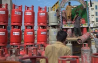 laborers unload gas calendar from a truck at a market on the outskirts of islamabad pakistan on september 2 2020 photo afp