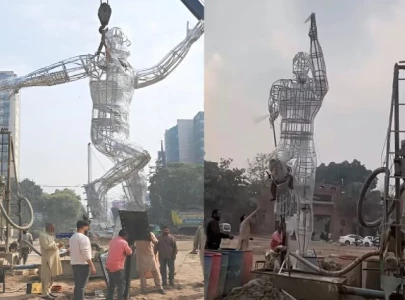 watch running man statue installed at newly renovated gaddafi stadium watch running man statue installed at newly renovated gaddafi stadium