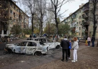 residents stand near their apartment buildings hit by a russian drone strike in the town of shakhtarske in dnipropetrovsk region ukraine october 19 2025 photo reuters file