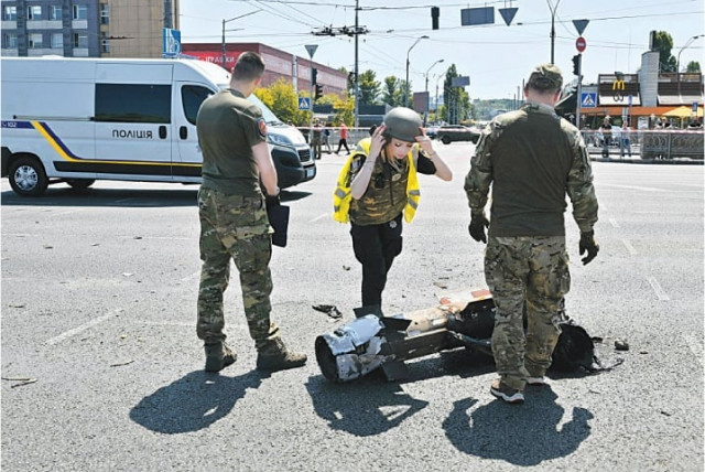 police experts examine fragments of a missile after russia fired a barrage of missiles in kyiv on monday photo afp police experts examine fragments of a missile after russia fired a barrage of missiles in kyiv on monday photo afp