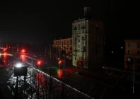 cars move along a dark street during a power blackout after a russian drone strike in ukraine s zaporizhzhia on january 7 2026 photo afp