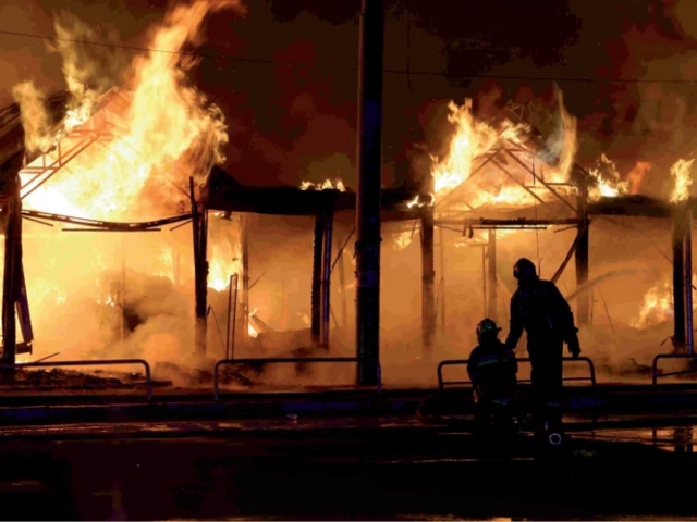 inferno aftermath ukrainian rescuers use a water hose as they work to extinguish a fire at the site of a russian strike in kyiv photo afp inferno aftermath ukrainian rescuers use a water hose as they work to extinguish a fire at the site of a russian strike in kyiv photo afp
